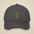 Casquette brodée RS Anthracite brodée du monogramme RS, vue de face sur fond pierre — Maison Sahari