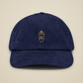 Casquette en velours côtelé Marine brodée du monogramme RS, vue de face sur fond pierre — Maison Sahari
