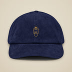 Casquette en velours côtelé Marine brodée du monogramme RS, vue de face sur fond pierre — Maison Sahari