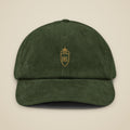 Casquette en velours côtelé Olive brodée du monogramme RS, vue de face sur fond pierre — Maison Sahari
