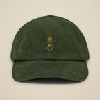 Casquette en velours côtelé Olive brodée du monogramme RS, vue de face sur fond pierre — Maison Sahari