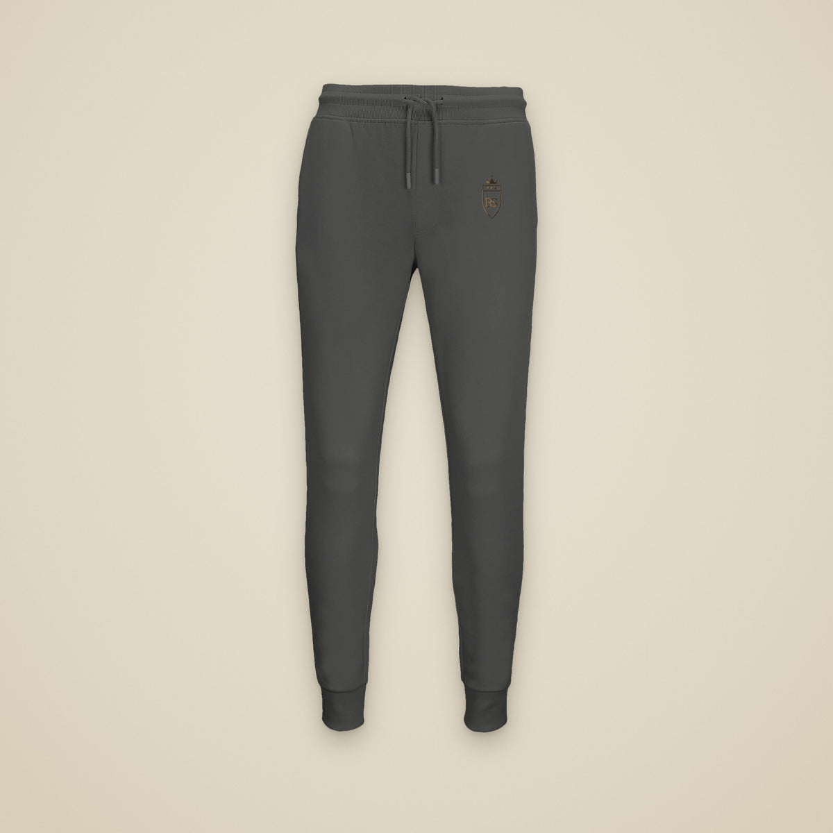 Jogging Anthracite chiné brodé du monogramme RS, vue de face sur fond pierre — Maison Sahari