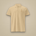 Polo piqué brodé RS Sable brodé du monogramme RS, vue de face sur fond pierre — Maison Sahari