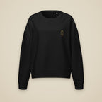 Sweat col rond femme Noir brodé du monogramme RS, vue de face sur fond pierre — Maison Sahari