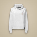 Sweat à capuche femme gris chiné clair brodé du monogramme RS, vue de face sur fond pierre — Maison Sahari
