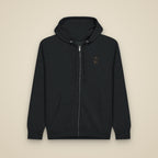 Sweat zippé Noir brodé du monogramme RS, vue de face sur fond pierre — Maison Sahari