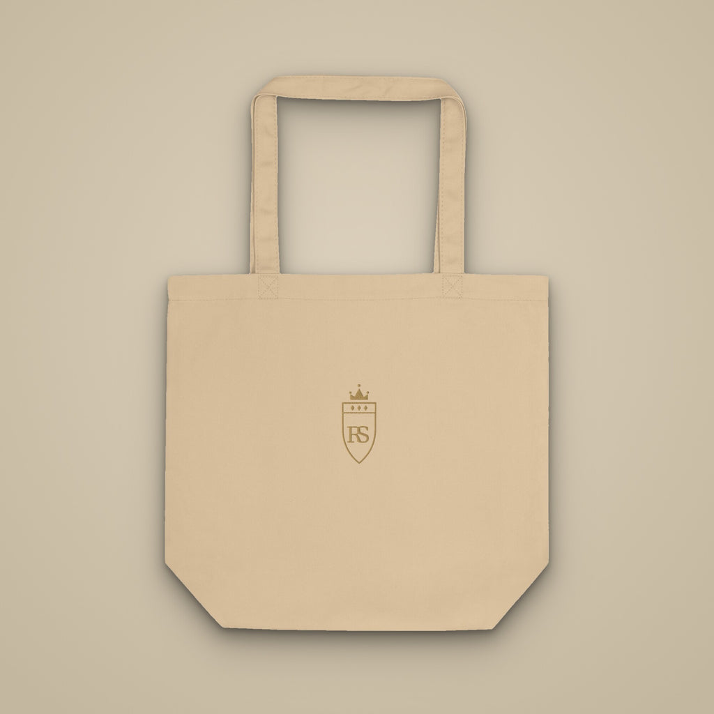 Tote bag sable brodé du monogramme RS, vue de face sur fond pierre — Maison Sahari