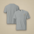 T-shirt brodé RS Granit brodé du monogramme RS, vue de face sur fond pierre — Maison Sahari